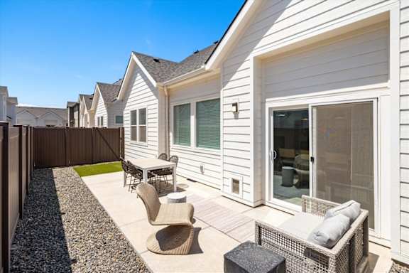 A white house with a patio furniture set. at Alante Homes at Spring Run, Caldwell, Idaho