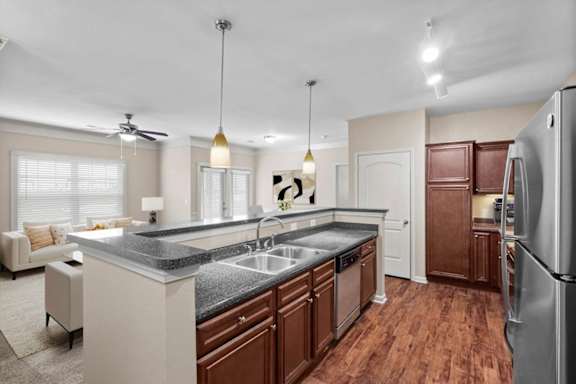 a kitchen with a sink and a refrigerator at Stonepost Ranch, Overland Park, KS, 66221