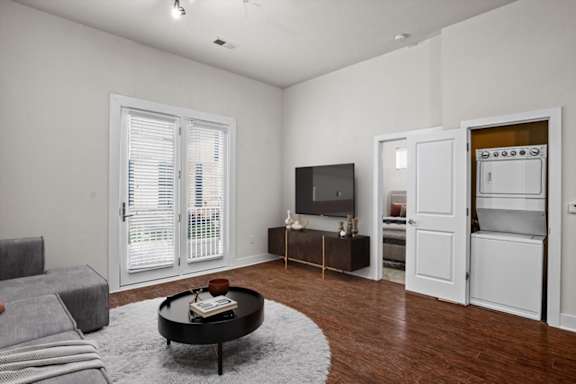 a living room with a couch and a tv at West 39th Street Apartments, Kansas City, 64111