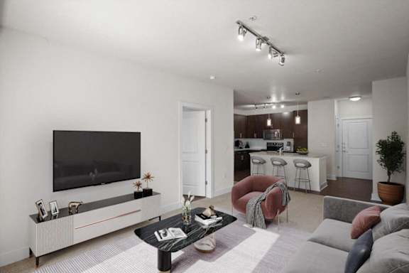a living room with a couch and a television at West 39th Street Apartments, Kansas City, 64111