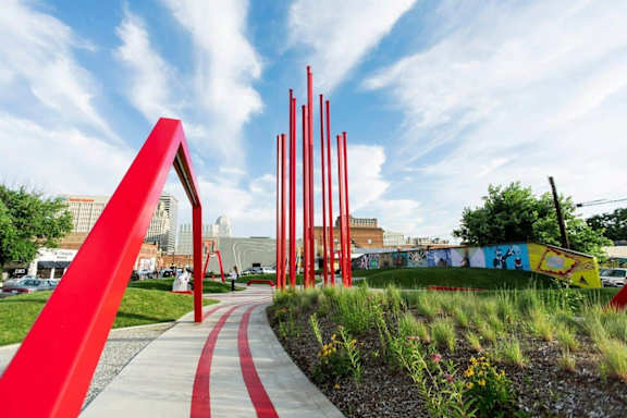 ARTivity on the Green arts district park in downtown Winston-Salem NC near Sugar Creek Apartments featuring public art and walking paths.