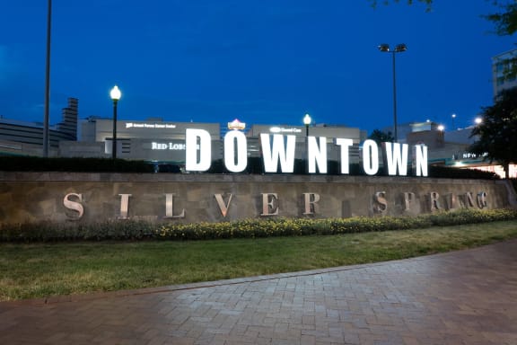 a sign with the words downtown silver spring in front of a building