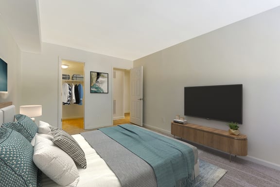a bedroom with a bed and a tv at Copper and Quarry Village, Pikesville, MD, 21209