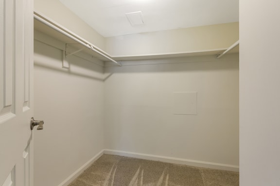 a walk in closet at the whispering winds apartments in pearland, tx at Copper and Quarry Village, Pikesville, MD, 21209