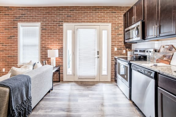 Fully Equipped Kitchen Includes Frost-Free Refrigerator, Electric Range, &amp; Dishwasher, at The Foundry, South Bend, IN 46617