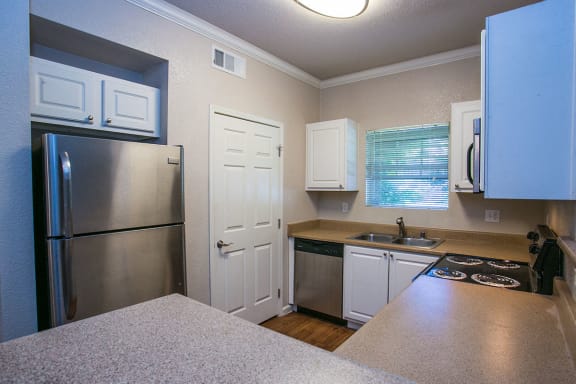 Full Kitchen with Dishwasher and Microwave at Suisun City Apartments