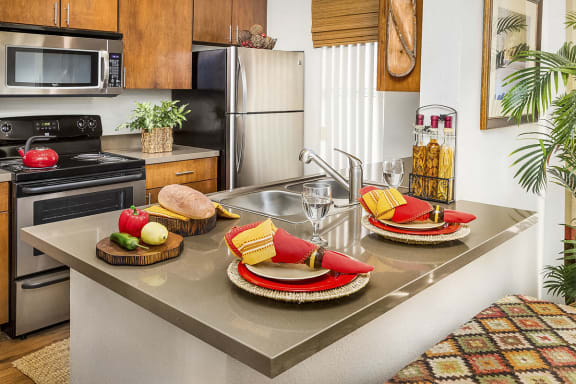 Kitchen with Stainless Steel Appliances at Midvale UT Apartments