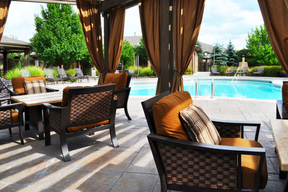Resort-Style Swimming Pool with Covered Cabanas at Apartments in Northglenn CO