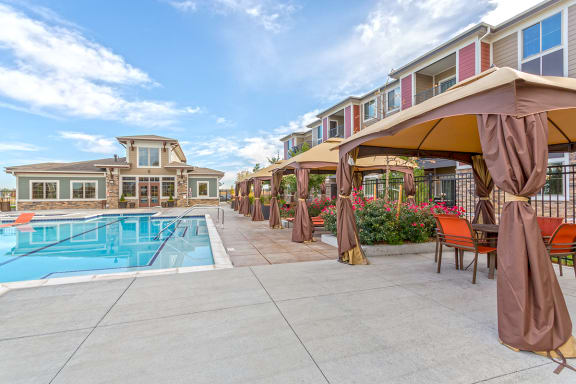 Swimming Pool with Cabanas at Solaire Apartments in Brighton, CO