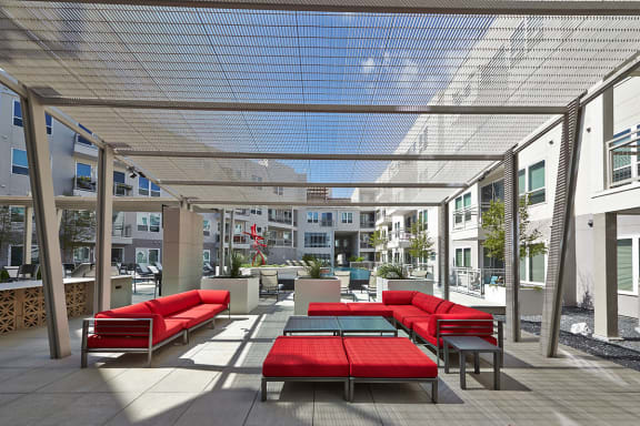 Sundeck with Shaded Lounge Seating at Apartments for Rent Oak Lawn Texas