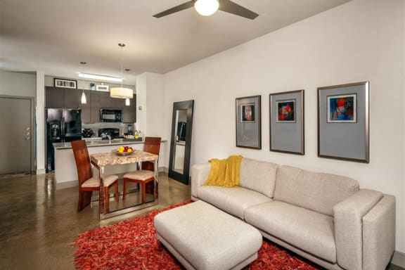 Spacious Living Room with Ceiling Fan at Apartments Cedar Springs