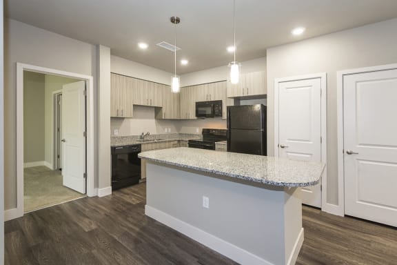 Full Kitchen with Granite Countertops at Northgate Colorado Springs Apartments for Rent
