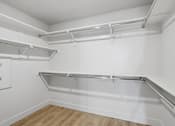 Thumbnail 21 of 51 - A white closet with a silver shelf on it at Brickside Heights, Millcreek, UT