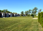 Thumbnail 15 of 22 - Dog park located next to apartment buildings