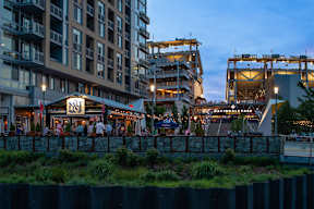 Salt restaurant with people sitting outside at dusk. at Dock 79, District of Columbia, 20003
