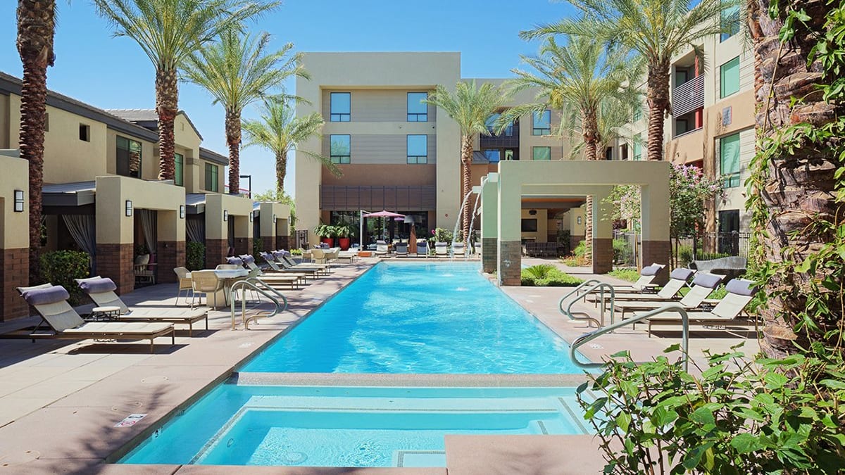 Pool and poolside area at Audere Apartments.