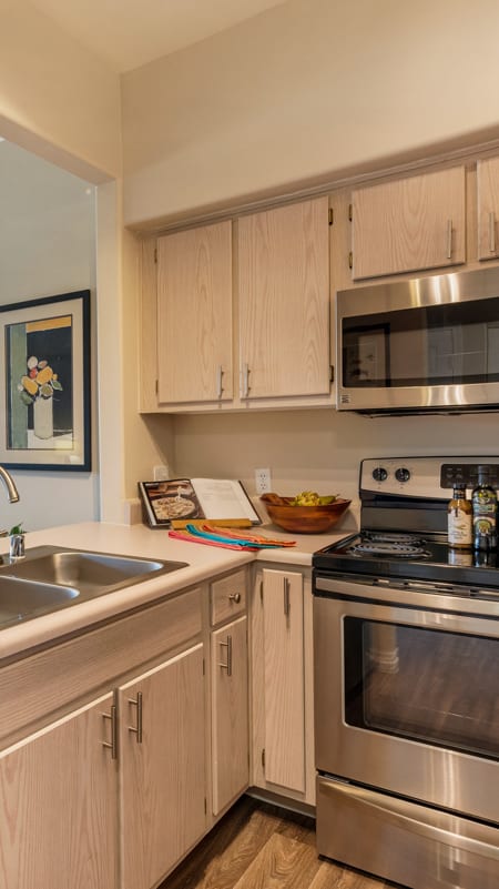 White Countertops in Apartment Kitchen