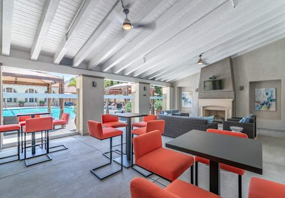 A patio with a table and chairs overlooking a pool at Sonoma at Porter Ranch, Porter Ranch, 91326