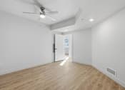 Thumbnail 26 of 51 - A room with a ceiling fan and wooden flooring at Brickside Heights, Millcreek, UT, 84106
