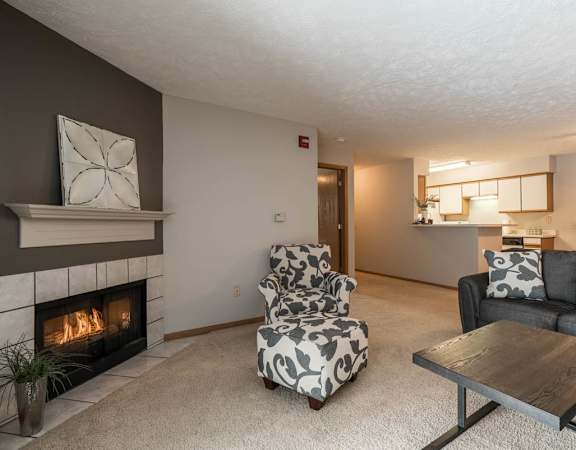 A living room with a fireplace and a couch.