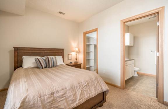 Large bedroom with attached bathroom and walk-in closet at Stone Ridge townhomes
