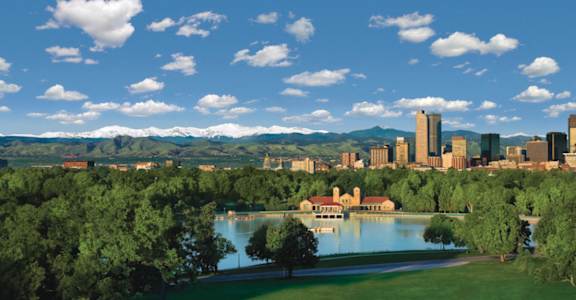 a view of the city from a park with a lake