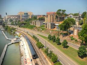 A train is on the tracks near a body of water.at Maplehurst Apartments, Tennessee