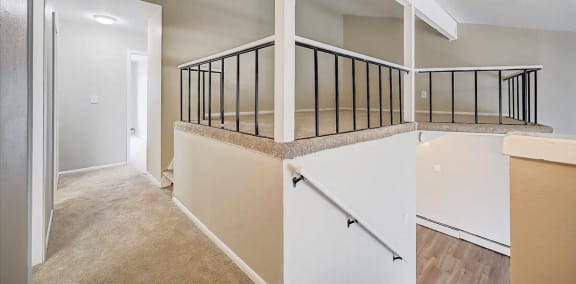 a view of the upstairs of a house with a staircase