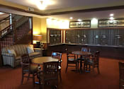 Thumbnail 5 of 5 - A room with a table and chairs and a couch.