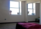 Thumbnail 16 of 18 - Bedroom with natural lighting at Hoffman Hotel Apartments