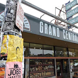 A bakery named Grand Central Baking Co. is shown with a sign above the entrance.