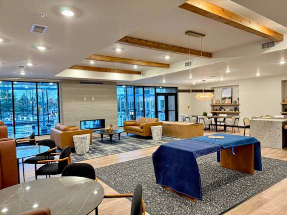 great room with couches and tables and a fireplace