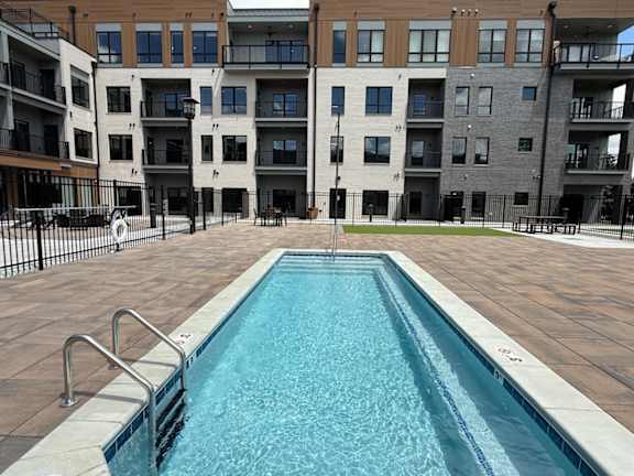 Small swimming pool in front of an apartment building