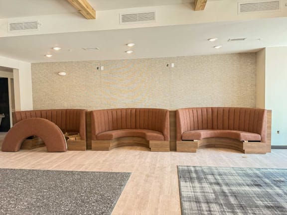 a large room with couches and a rug
