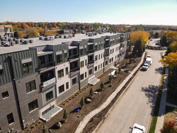 a view of a building from above with a street