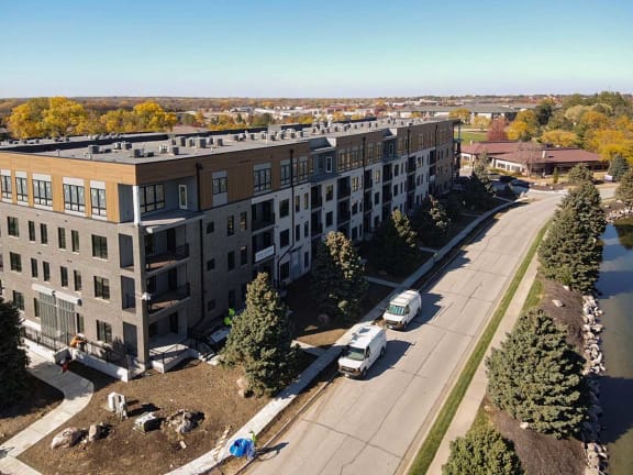 an aerial view of an apartment building and a street