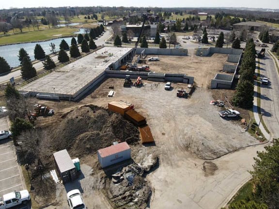 an aerial view of a construction site with trucks and machinery