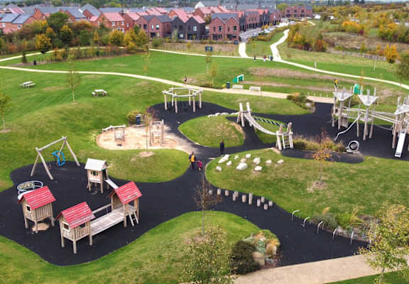 an aerial view of a playground in a park