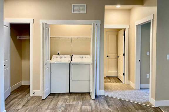 A laundry room with a washer and dryer in it.