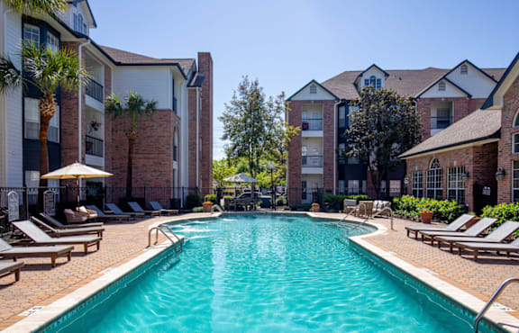 Swimming Pool With Lounge Chairs at Whitney at the Heights, Houston, TX, Texas