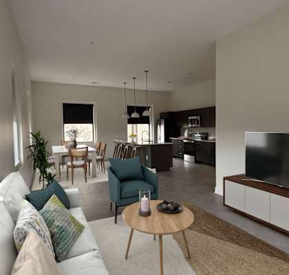 A modern living room with a white sofa, a wooden coffee table, and a large flat-screen TV. at The Annex Apartments, Buffalo, NY, 14222