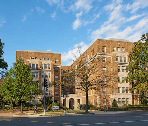 a large brick building on the corner of a street