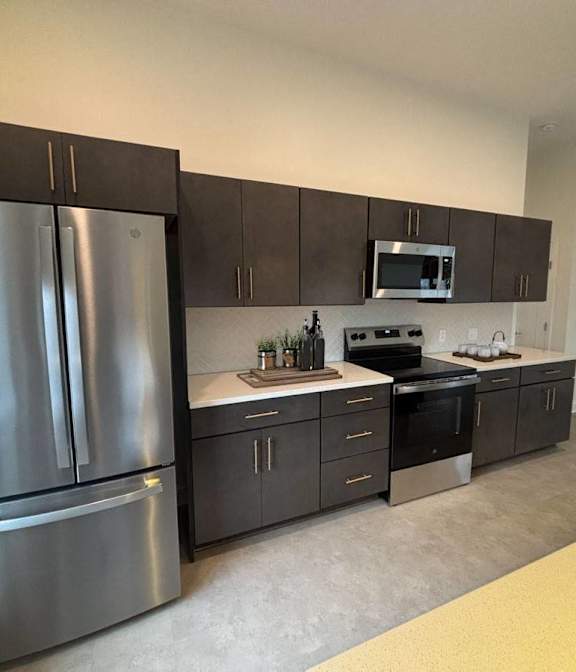 A floor plan for a home gym with a fireplace, exercise equipment, and a fitness center. at The Annex Apartments, Buffalo, NY, 14222