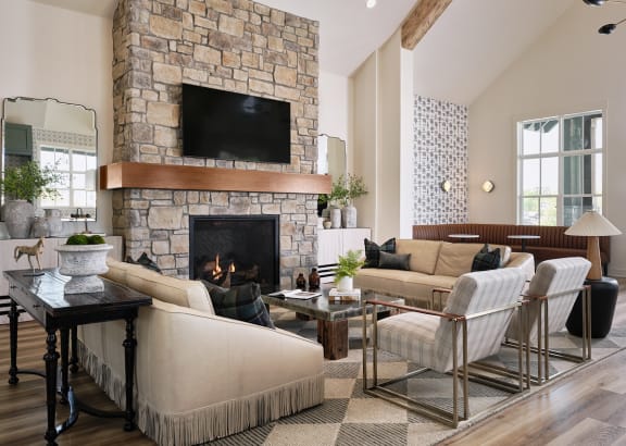 a kitchen with a white marble counter top and black chairs