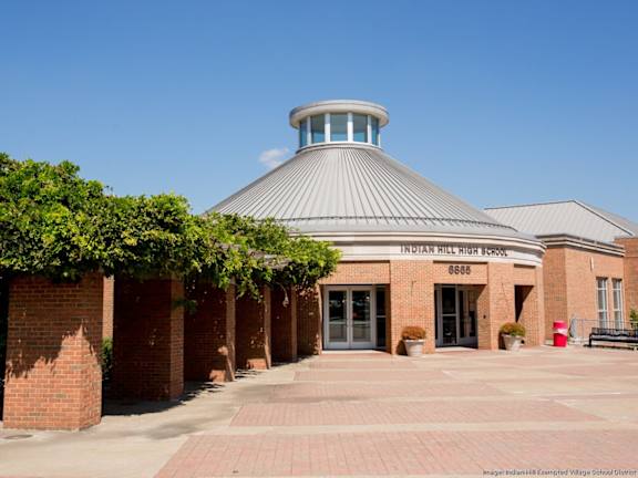 A school building with a dome and a sign that says Indian Hills High School.