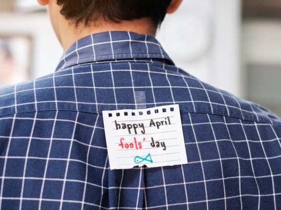 Guy with April Fools sticker on his back at Mirabella Apartments, Bermuda Dunes, California