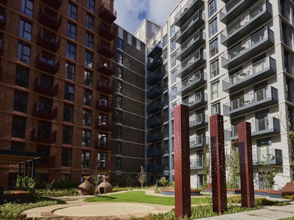 a large apartment building with a courtyard in front of it