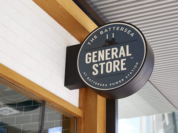a general store sign on the side of a building