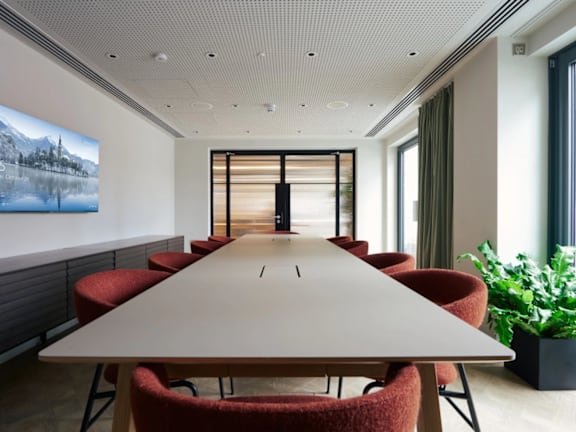 a conference room with a long table and chairs