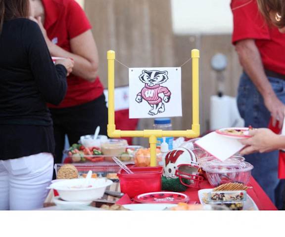 A table with food and a sign with a cartoon character on it.